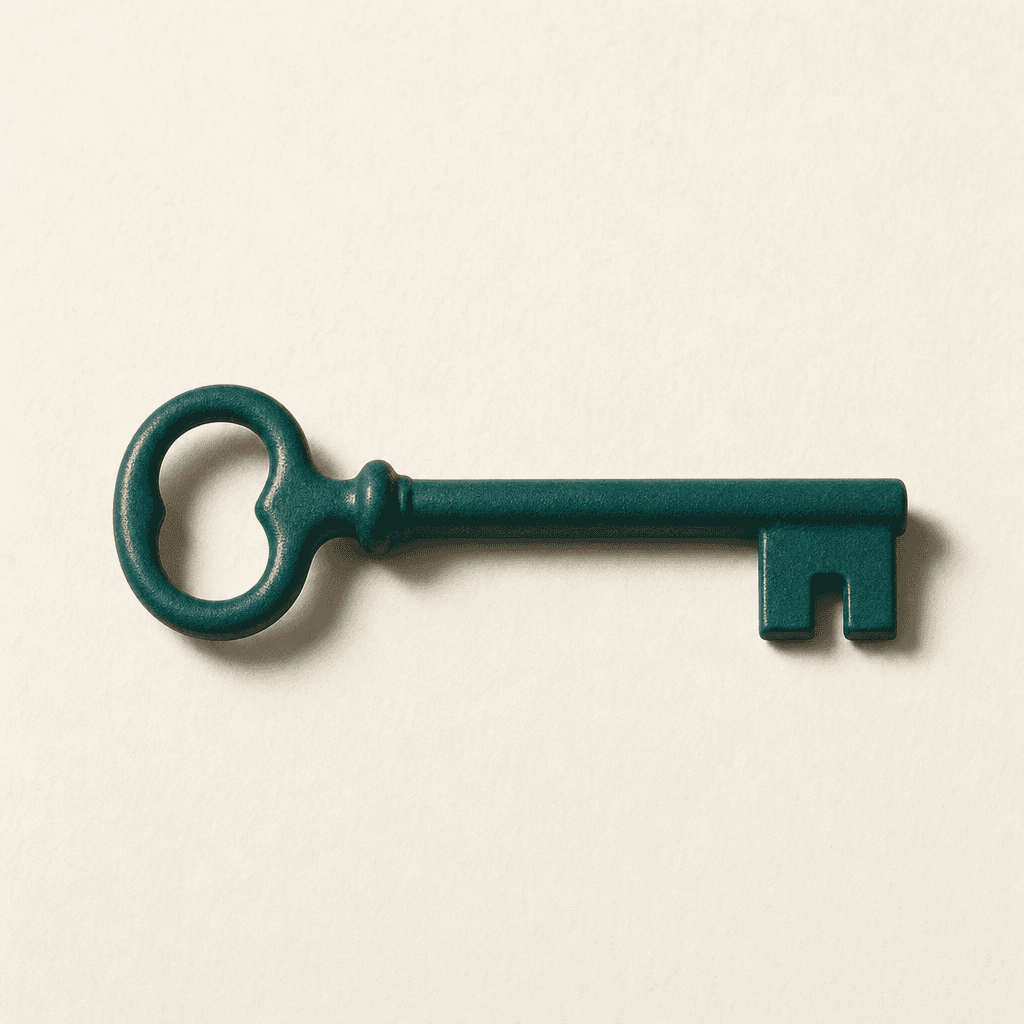 A single solid cast-metal key in matte deep teal, lying flat on a cream paper surface — minimal, weighty, iconic.